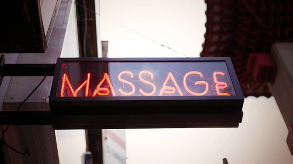 Representational image of a massage parlour board