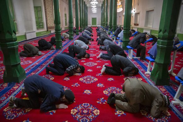 Uyghurs and other members of the faithful pray during services at the Id Kah Mosque in April 2021.